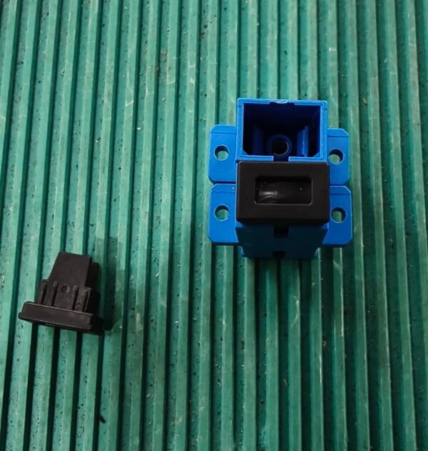 Genuine Huawei LC/PC simplex fiber optic adapter blue connector with black dust cap and metal ferrule on green background